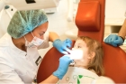 Удаление постоянного зуба у детей простое