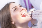 Удаление зуба двухкорневого